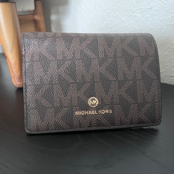 Michael Kors Handbags - Michael Kors Jet Set Dark Brown Slim Leather Wallet Black Interior Snap Closure